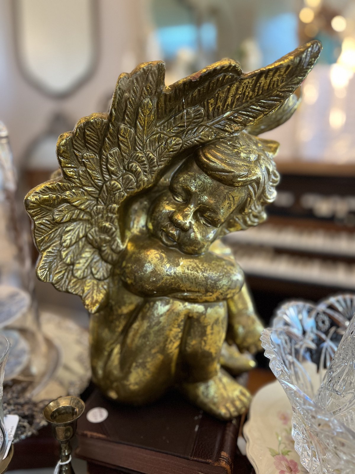 Weathered gold-leaf cherub bust